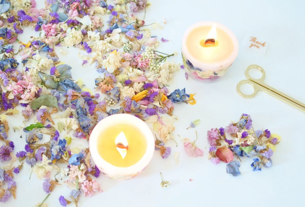 ROCA candle making — hand-poured soy candle with botanicals