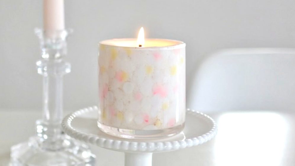 A single ROCA candle, softly lit